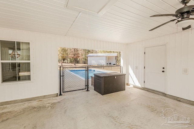 interior space with ceiling fan