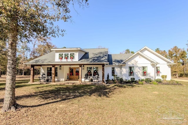 view of front of home featuring french doors and a front yard