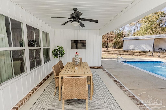 exterior space with ceiling fan