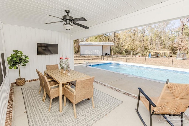 view of pool featuring ceiling fan and a patio