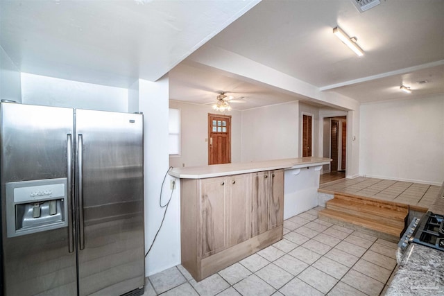 kitchen featuring ceiling fan, stainless steel fridge with ice dispenser, and light tile patterned floors