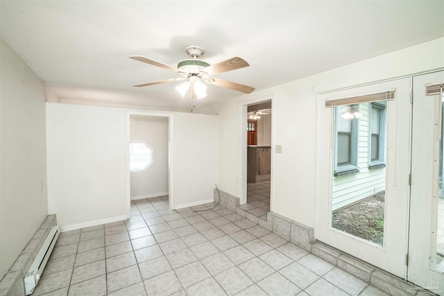 spare room with ceiling fan and a baseboard heating unit