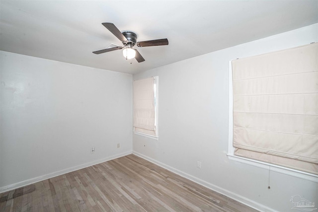 spare room with light hardwood / wood-style flooring and ceiling fan