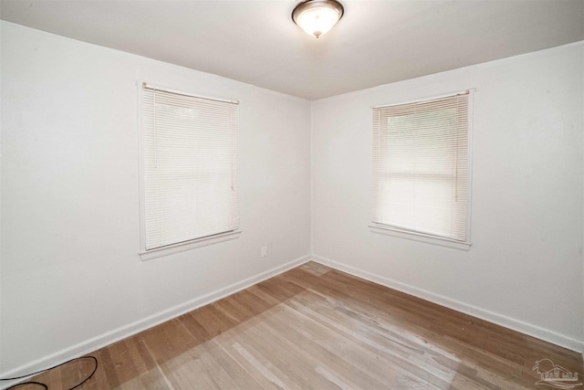 empty room with wood-type flooring