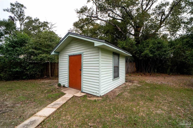 view of outbuilding with a lawn