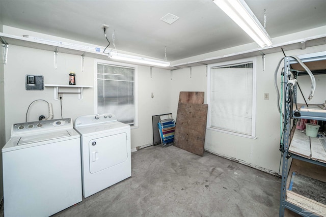 clothes washing area featuring washer and dryer