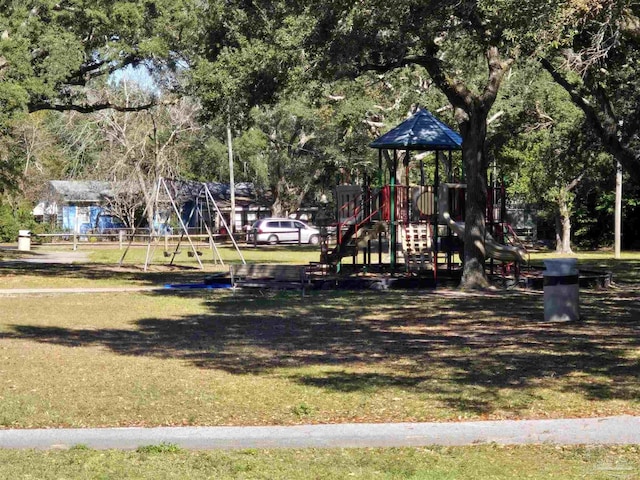 view of playground with a lawn