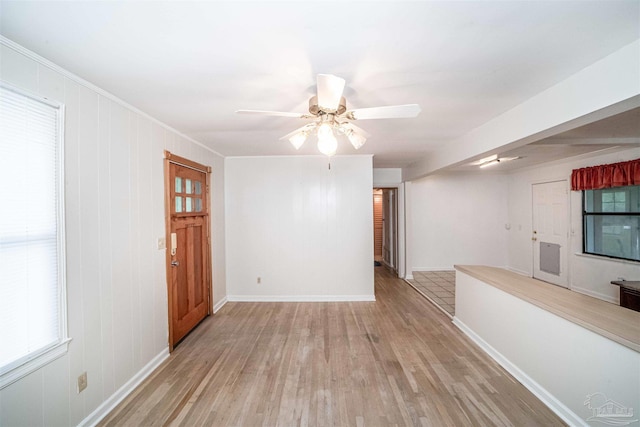 unfurnished room featuring light hardwood / wood-style flooring and ceiling fan