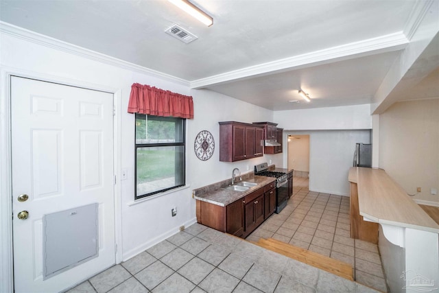 kitchen with light tile patterned flooring, ornamental molding, sink, and appliances with stainless steel finishes