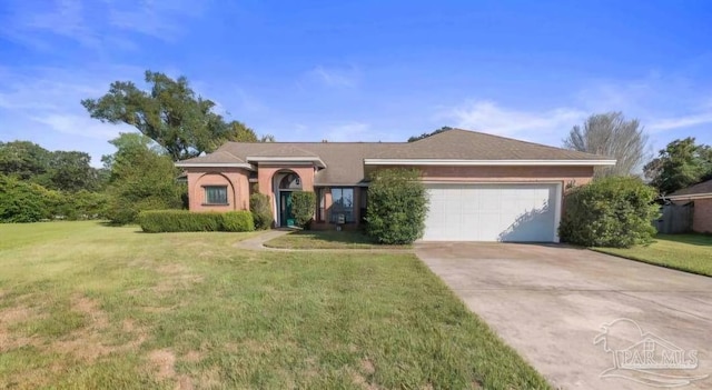 single story home featuring a front lawn and a garage