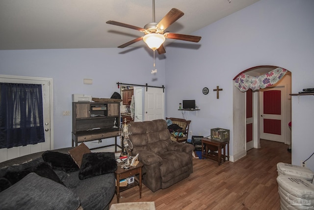 5800 Providence Loop, Pensacola, FL 32526 - living room with vaulted ceiling, a barn door, wood finished floors, and ceiling fan