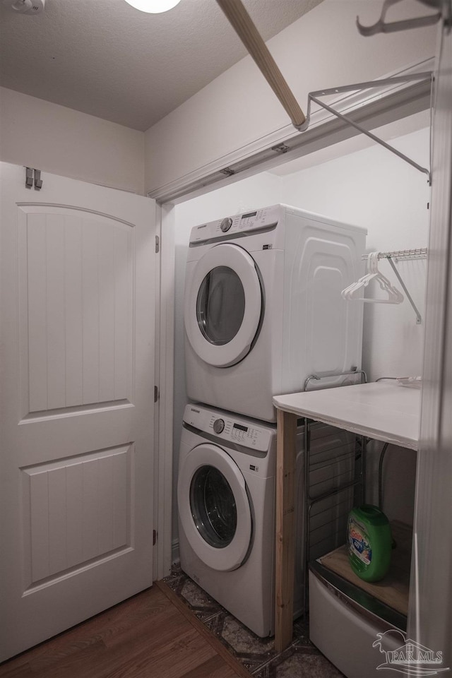 5800 Providence Loop, Pensacola, FL 32526 - laundry room with estacked washer and dryer and wood finished floors