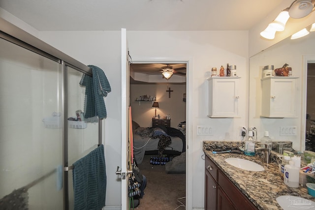 5800 Providence Loop, Pensacola, FL 32526 - full bathroom with double vanity, a shower stall, a ceiling fan, and connected bathroom