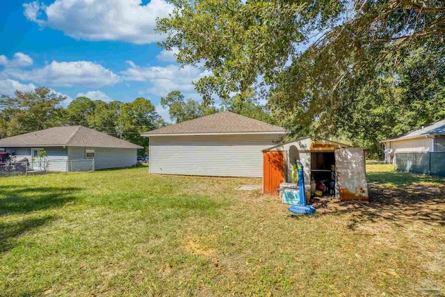 view of yard with a storage unit