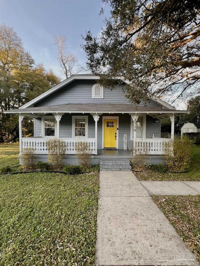 view of front of home featuring a porch and a front yard