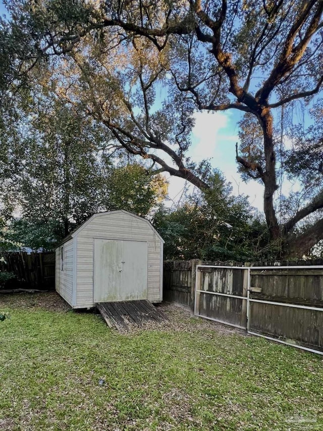 view of shed with a fenced backyard