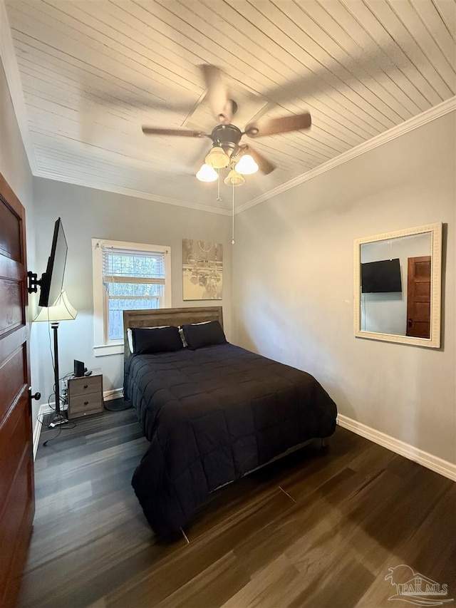 bedroom with wooden ceiling, crown molding, baseboards, and wood finished floors