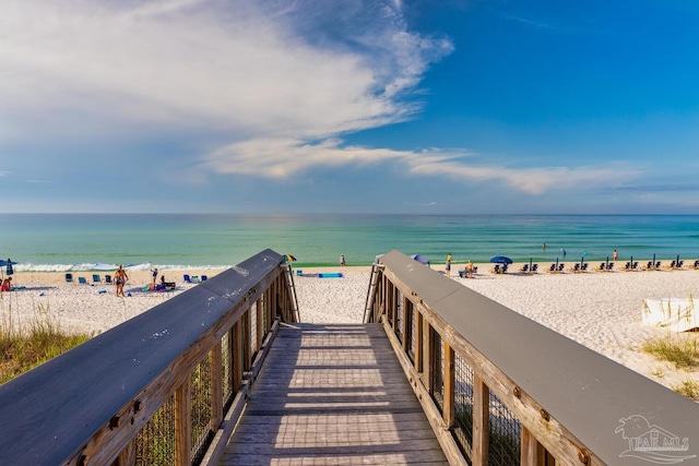 exterior space with a water view and a view of the beach