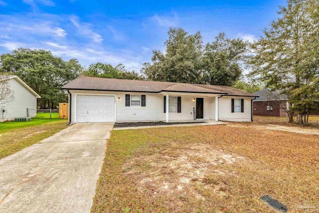 ranch-style home with a garage and a front lawn