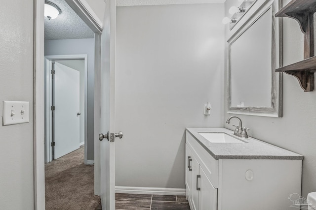 bathroom featuring vanity and a textured ceiling