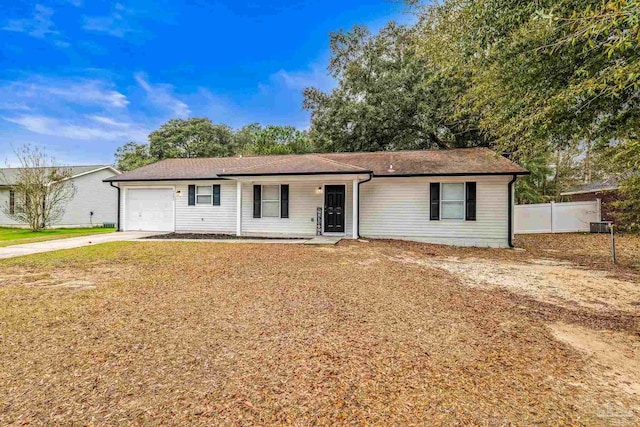 single story home featuring a garage and a front lawn