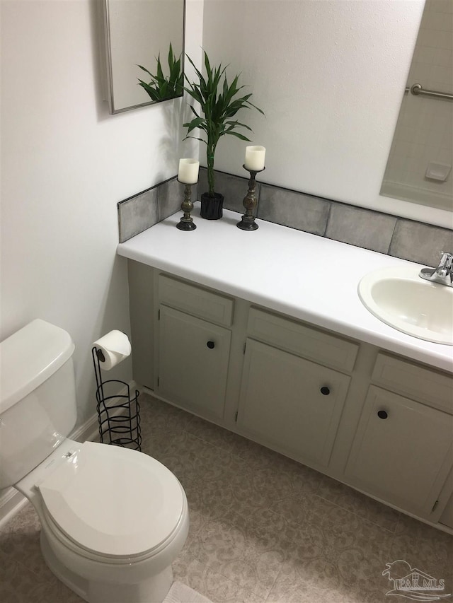 3385 Olive Rd Unit 2-D, Pensacola, FL 32514 - bathroom with vanity, toilet, and tile patterned floors