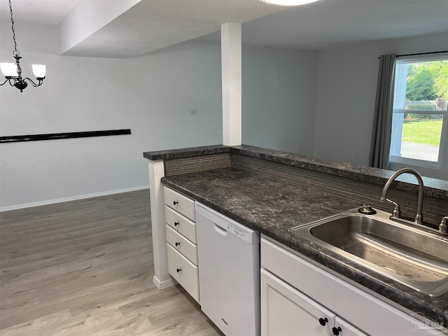 3385 Olive Rd Unit 2-D, Pensacola, FL 32514 - kitchen with dishwasher, a sink, white cabinetry, light wood-style flooring, and a chandelier