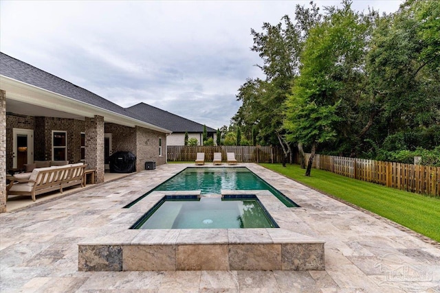 view of pool featuring outdoor lounge area, a patio area, and an in ground hot tub