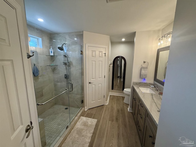 1450 N 11th Ave, Pensacola, FL 32503 - full bath featuring wood finished floors, a stall shower, vanity, and recessed lighting