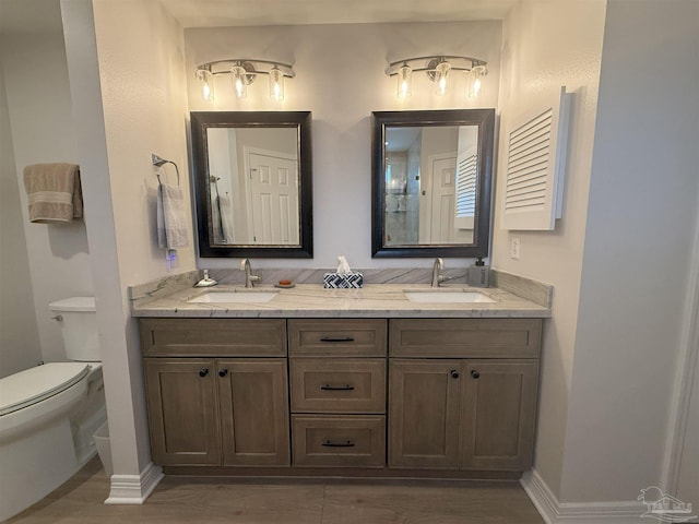 1450 N 11th Ave, Pensacola, FL 32503 - full bath with double vanity and wood finished floors
