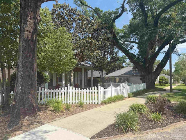 1450 N 11th Ave, Pensacola, FL 32503 - view of property hidden behind natural elements with a fenced front yard