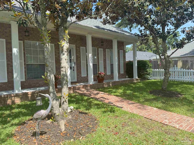 1450 N 11th Ave, Pensacola, FL 32503 - view of exterior entry featuring brick siding and covered porch