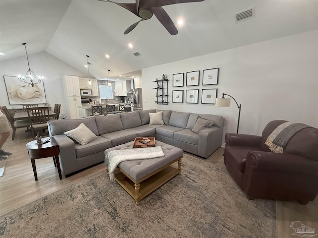 1450 N 11th Ave, Pensacola, FL 32503 - living room featuring light wood-style flooring, ceiling fan, and lofted ceiling