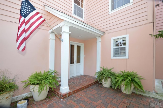 property entrance featuring french doors