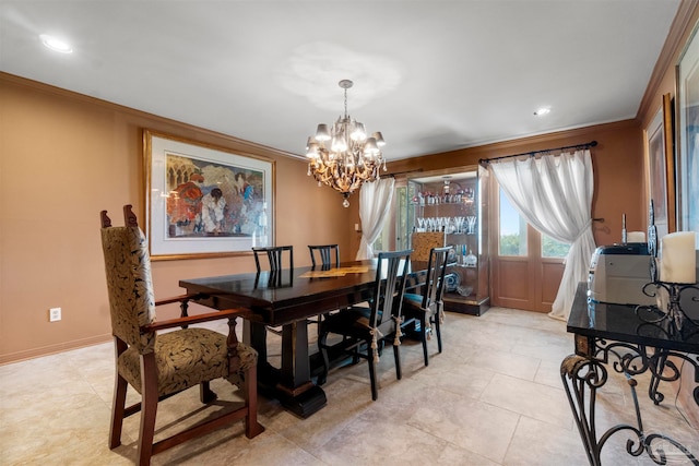 dining space featuring an inviting chandelier, light tile patterned flooring, and ornamental molding