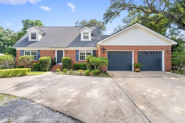 new england style home featuring a garage