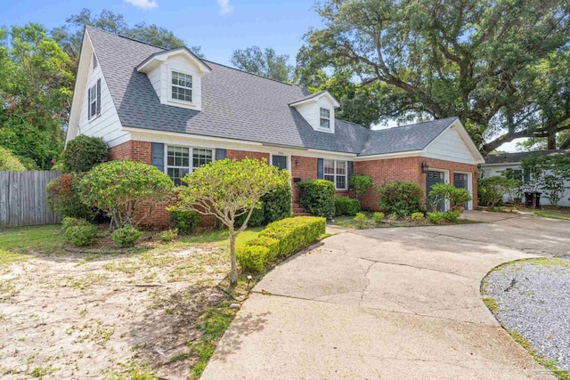 new england style home with a garage