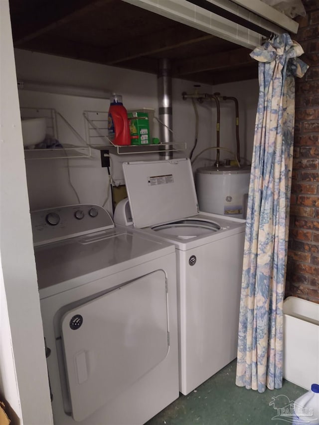 laundry area with water heater, independent washer and dryer, and laundry area