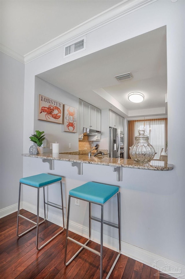 13621 Perdido Key Dr Unit 1504-E, Perdido Key, FL 32507 - kitchen with under cabinet range hood, stainless steel refrigerator with ice dispenser, visible vents, and dark wood finished floors