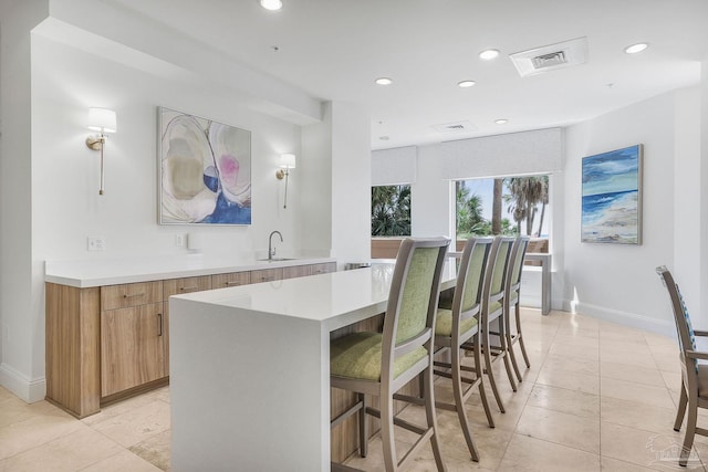 13621 Perdido Key Dr Unit 1504-E, Perdido Key, FL 32507 - kitchen with a sink, light countertops, baseboards, and recessed lighting