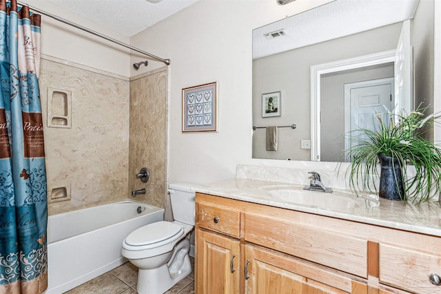 bathroom featuring tile patterned floors, visible vents, shower / bath combo with shower curtain, toilet, and a textured ceiling