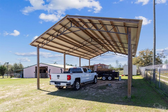 view of car parking featuring a carport, fence, and driveway