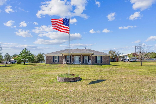 view of front of property with brick siding and a front lawn