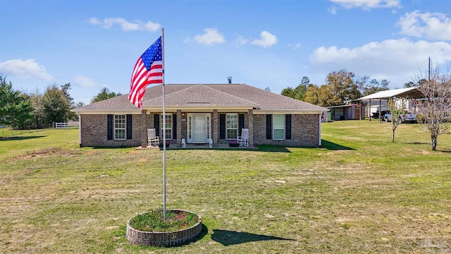 ranch-style home featuring brick siding and a front lawn