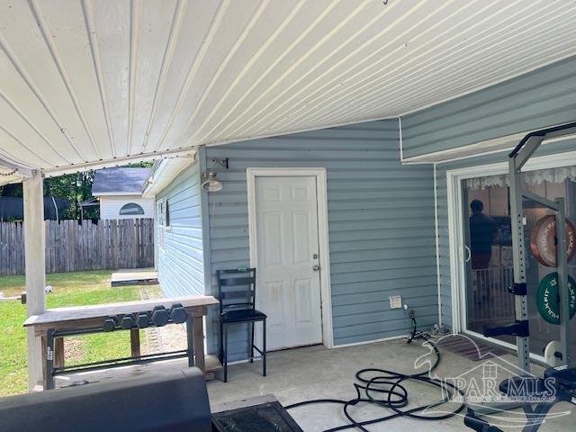 view of patio featuring fence