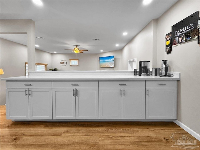 202 Henry St, Pensacola, FL 32507 - kitchen with ceiling fan, light wood finished floors, recessed lighting, light countertops, and baseboards