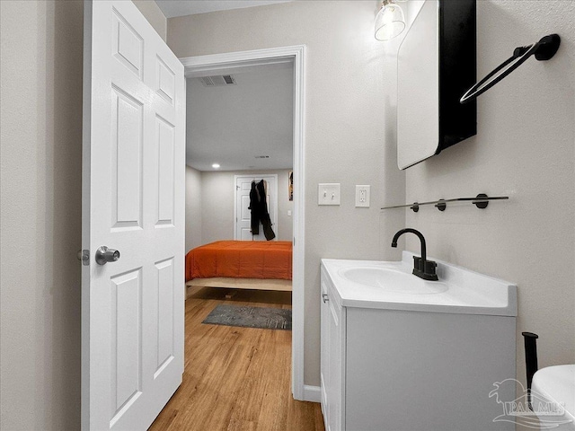 202 Henry St, Pensacola, FL 32507 - bathroom featuring wood finished floors and vanity