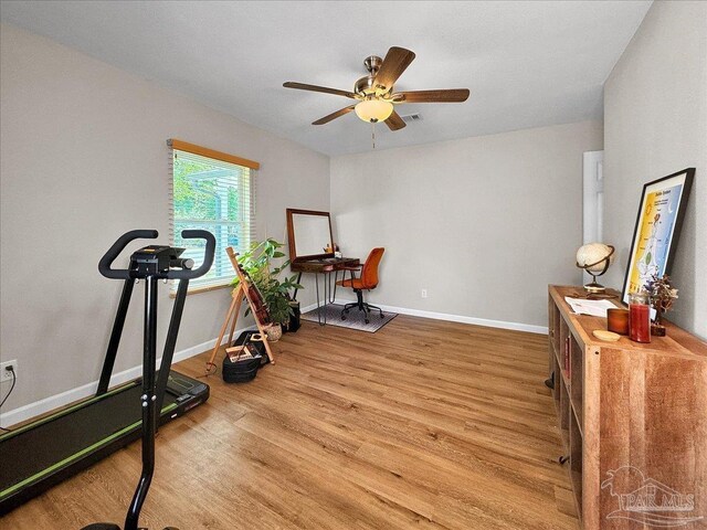 202 Henry St, Pensacola, FL 32507 - exercise room featuring wood finished floors, baseboards, and ceiling fan
