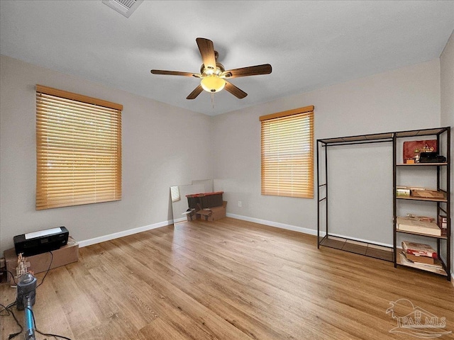 202 Henry St, Pensacola, FL 32507 - unfurnished bedroom featuring wood finished floors, baseboards, and ceiling fan