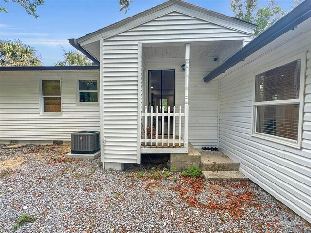 202 Henry St, Pensacola, FL 32507 - property entrance with central air condition unit and crawl space